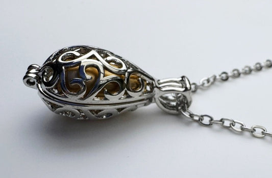 Golden Memorial Urn Pendant – Encased in Nature-Inspired Stainless Steel