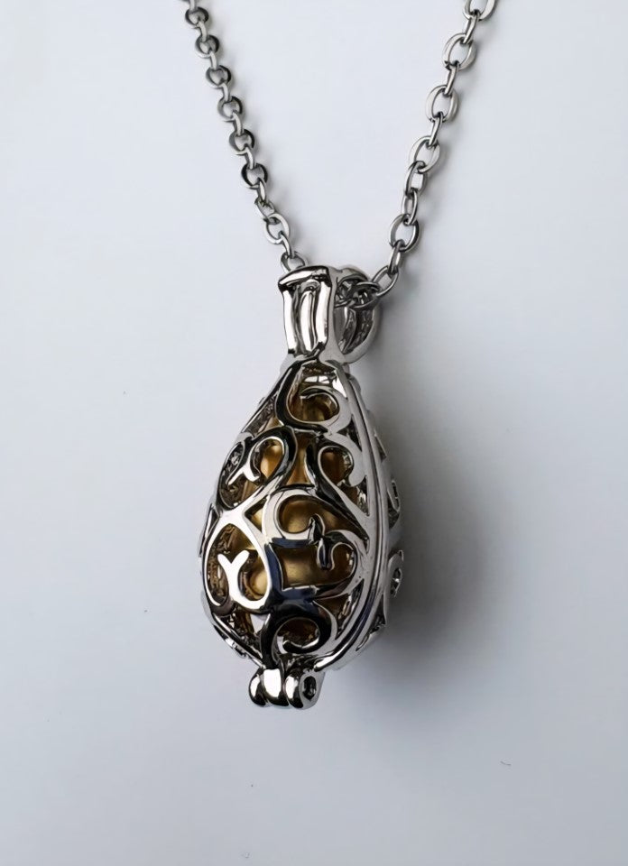Golden Memorial Urn Pendant – Encased in Nature-Inspired Stainless Steel
