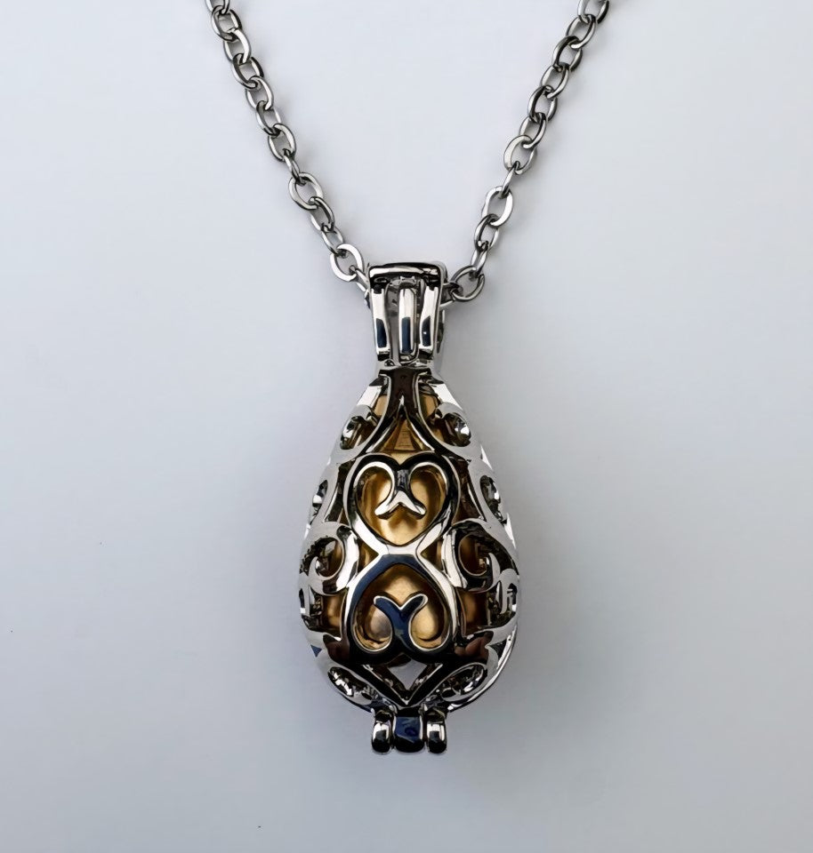 Golden Memorial Urn Pendant – Encased in Nature-Inspired Stainless Steel